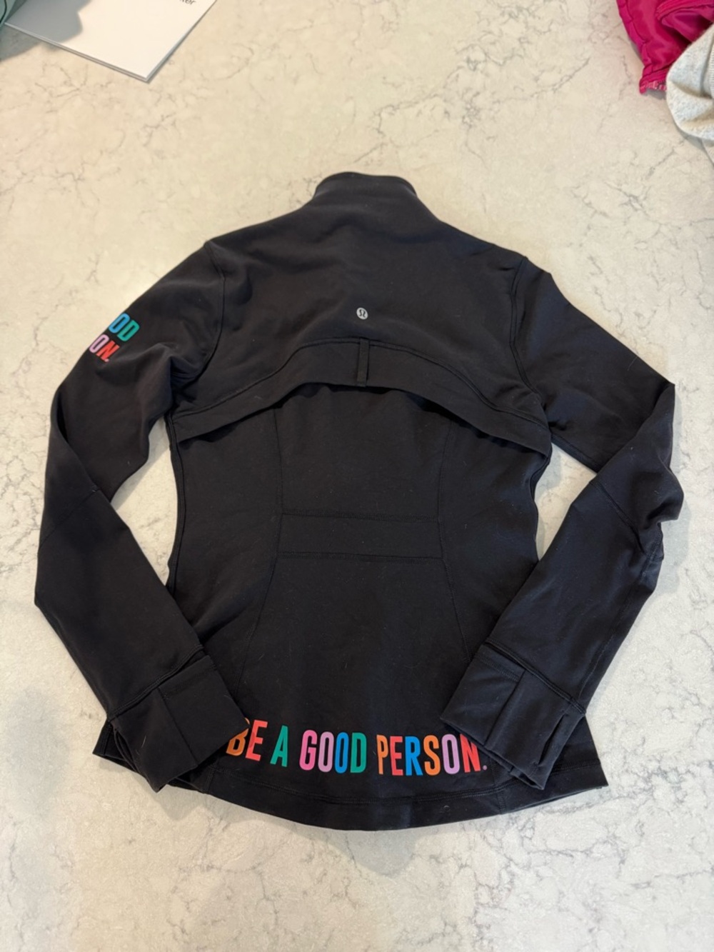 Define jacket Luon: Lululemon and be a good person/black collaboration
